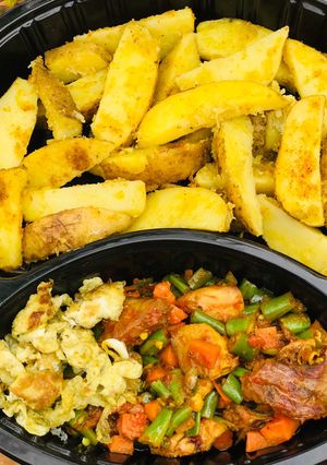 A picture of Baked potatoes and vegetable sauce.