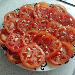 Una foto de Tomate con aceite y ajo