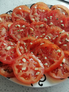 Una foto de Tomate con aceite y ajo