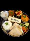 Kathiyawadi Lunch Thali (Dahi Tikhari, Sev Tameta Nu Shak, Dal Bhaat, Fulka Rotli, Chaas, Papad)