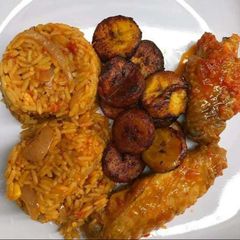 A picture of Jollof rice,turkey and fried plantain.