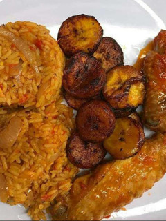 A picture of Jollof rice,turkey and fried plantain.