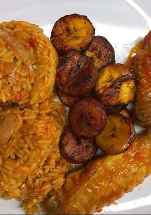 A picture of Jollof rice,turkey and fried plantain.