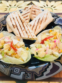 A picture of Baffulo wraps with healthy salad.