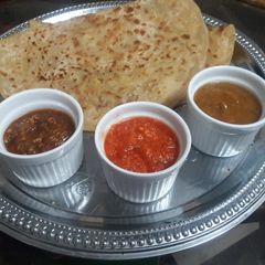 Aloo ke parathe with a variety of delicious chatnies A picture of Aloo ke parathe with a variety of delicious chatnies.