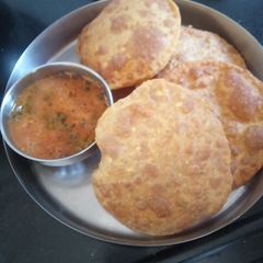 A picture of Radha Rani (Bedmi Puri) and Sabzi.