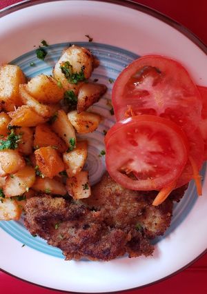 Una foto de Papas salteadas con ajo y limón..