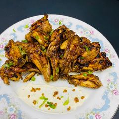 A picture of The mustard honey wings.