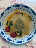 Raviolo aperto con merluzzo e pomodorini
