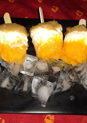 A picture of Grapes orange yogurt popsicles.