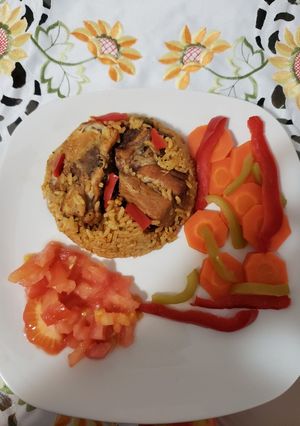 Una foto de Locrio de carne de cerdo y pollo