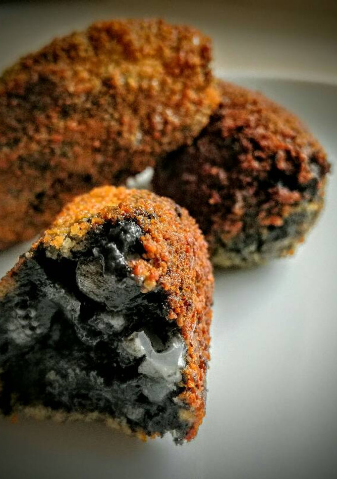 Una foto de Croquetas de Sepia en su tinta