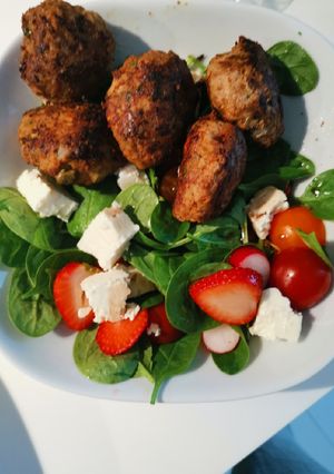 A picture of Meatballs with feta and olives.