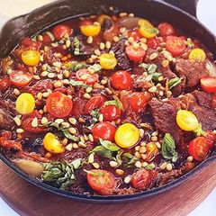 A picture of Braised Wagyu Beef, Shallot, Tomato, and Basil Skillet.