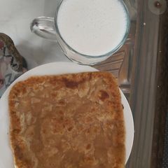 A picture of لسی اور دیسی گھی کا پراٹھا.