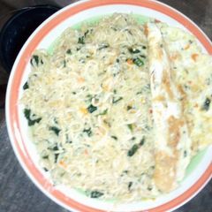 A picture of Indomie veggies with fried egg.