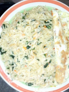 A picture of Indomie veggies with fried egg.
