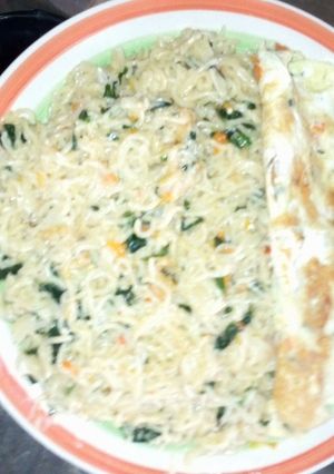 A picture of Indomie veggies with fried egg.