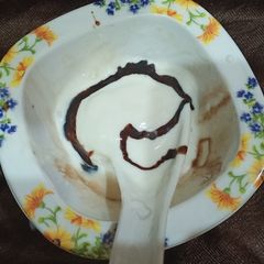 Vanilla Ice cream(with chocolate syrup) A picture of Vanilla Ice cream(with chocolate syrup).