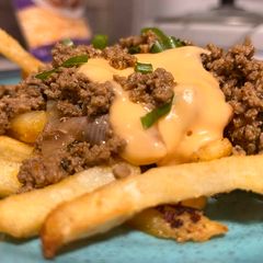 A picture of Cheesy fries with tawa keema.