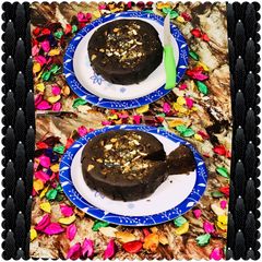 A picture of Eggless coffee & nuts plum cake in microwave.