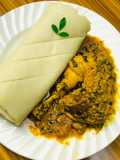 Egusi soup and rolled up pounded yam