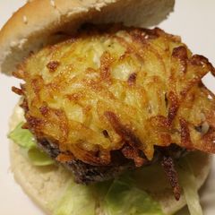 A picture of Fluffy's homemade hash brown cheese burger.