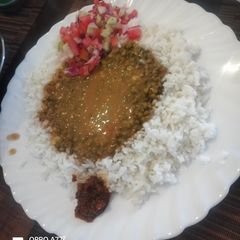 A picture of Coconut rice with creamy green grams.