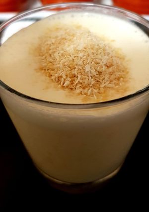 A picture of My Mango milk shake with grated coconut. 😊.
