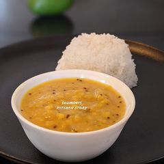 A picture of Kachcha Aam Dal (Red lentil with raw mango).