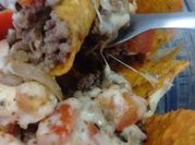 Una foto de nacho con carne molida