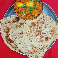 A picture of Dahi Aloo With Paratha.