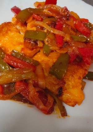 Una foto de Bacalao con pimiento y cebolla
