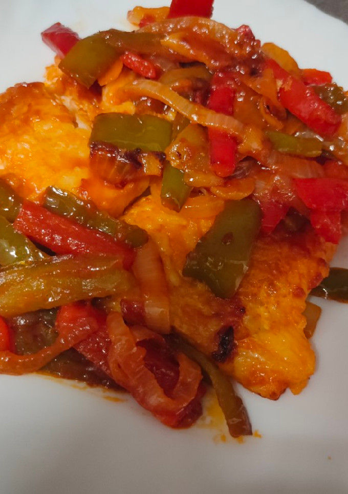 Una foto de Bacalao con pimiento y cebolla