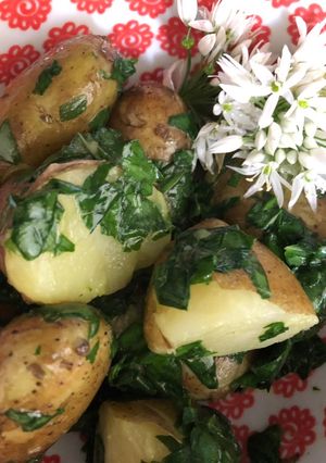 A picture of New potatoes with wild garlic.