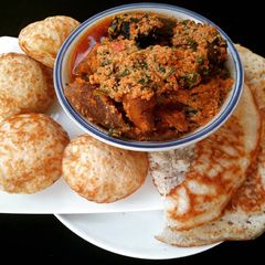 A picture of Sinasir, masa and egusi soup.