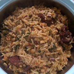 A picture of Moringa jollofrice and beans.