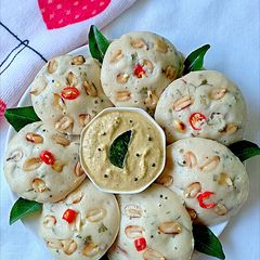 A picture of Roasted peanut millet idli with peanut coconut chutney.