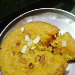 A picture of Custard cake with almonds.