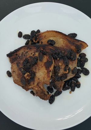 A picture of Pan Roasted Pork Chops with Toasted Raisins.