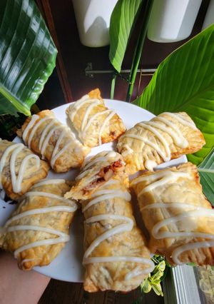 A picture of Apple Cinnamon Pockets with Cream Cheese Icing.