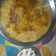 A picture of Samak rice khichdi with curd.