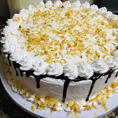 A picture of Coconut cake with whipped cream frosting 🤤🤤🤤.