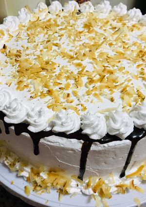 A picture of Coconut cake with whipped cream frosting 🤤🤤🤤.