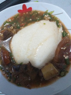 A picture of Semolina with okra soup.