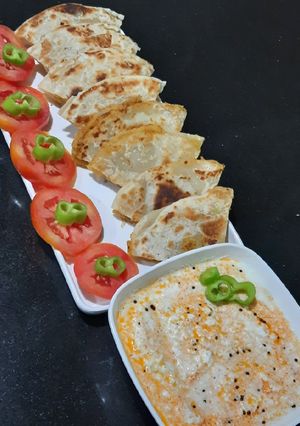 A picture of Jain Punjabi Chole Paratha with Dahi Tikhari.