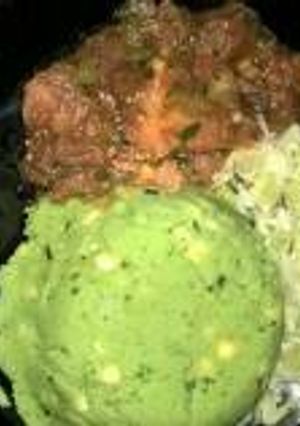 A picture of Mukimo served with wet fry beef and steamed cabbage.