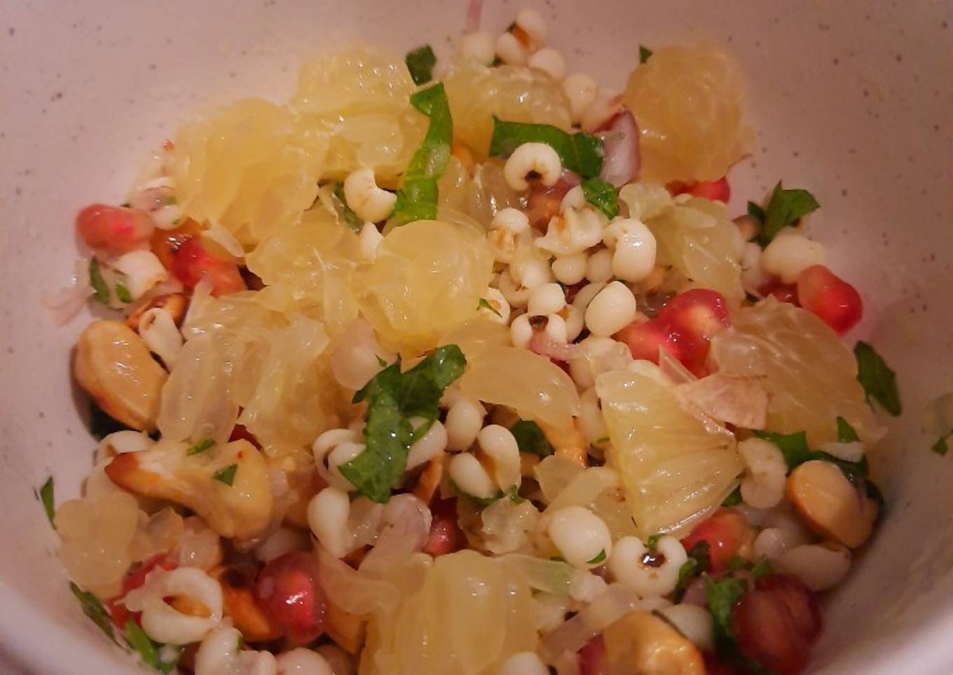 Cold barley salad with pomelo, pomegranate, cashews, and shiso