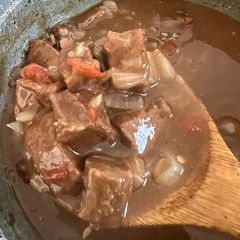 A picture of Beef cubes and rice.