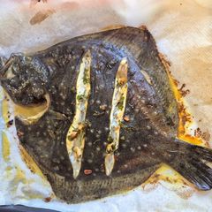 A picture of Roasted Turbot Stuffed with Fresh Herbs and Lemon.